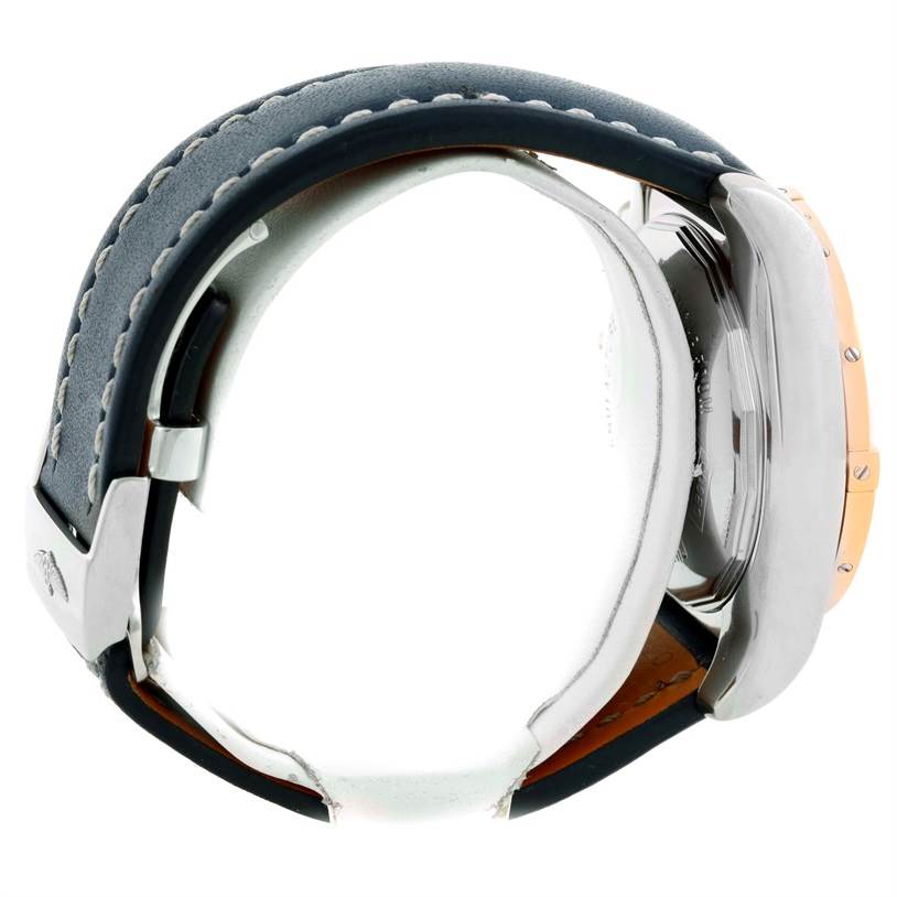 The image shows a side view of a Breitling Chronomat CB0110 Men's Steel and Gold (two tone) Blue Dial CB0110 Men's Steel and Gold (two tone) Blue Dial watch, focusing on the case, bezel, and part of the leather strap.