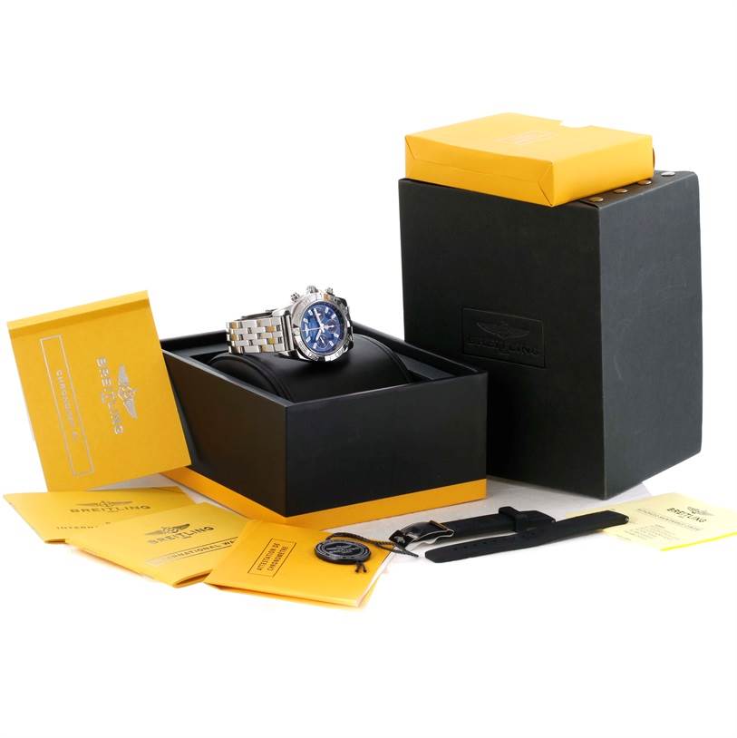 The image shows a Breitling Chronomat AB0410 Men
s Stainless Steel Blue Dial AB0410 Men
s Stainless Steel Blue Dial watch, its box, manuals, and accessories at an angled top-front view.