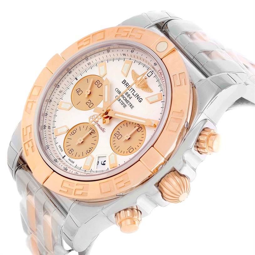 This Breitling Chronomat CB014012-G713-378C Men
s Steel and Gold (two tone) White Dial CB014012-G713-378C Men
s Steel and Gold (two tone) White Dial watch is shown from an angled side view, highlighting the face, bezel, crown, and pushers.