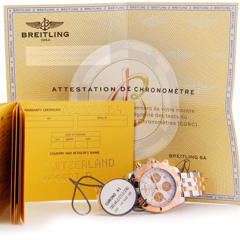 The image showcases a Breitling Chronomat CB014012-G713-378C Men
s Steel and Gold (two tone) White Dial CB014012-G713-378C Men
s Steel and Gold (two tone) White Dial watch, warranty certificate, and Chronomètre attestation documents.