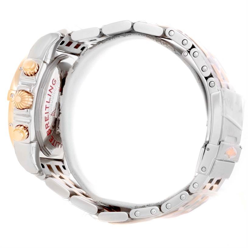 The image shows a side view of the Breitling Chronomat CB014012-G713-378C Men
s Steel and Gold (two tone) White Dial CB014012-G713-378C Men
s Steel and Gold (two tone) White Dial watch, highlighting the crown, pushers, case, and part of the band.