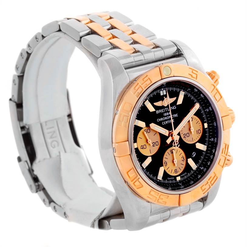 The Breitling Chronomat CB0110 Men's Steel and Gold (two tone) Black Dial CB0110 Men's Steel and Gold (two tone) Black Dial watch is shown at an angled view, highlighting its two-tone bracelet, face, and bezel with subdials.
