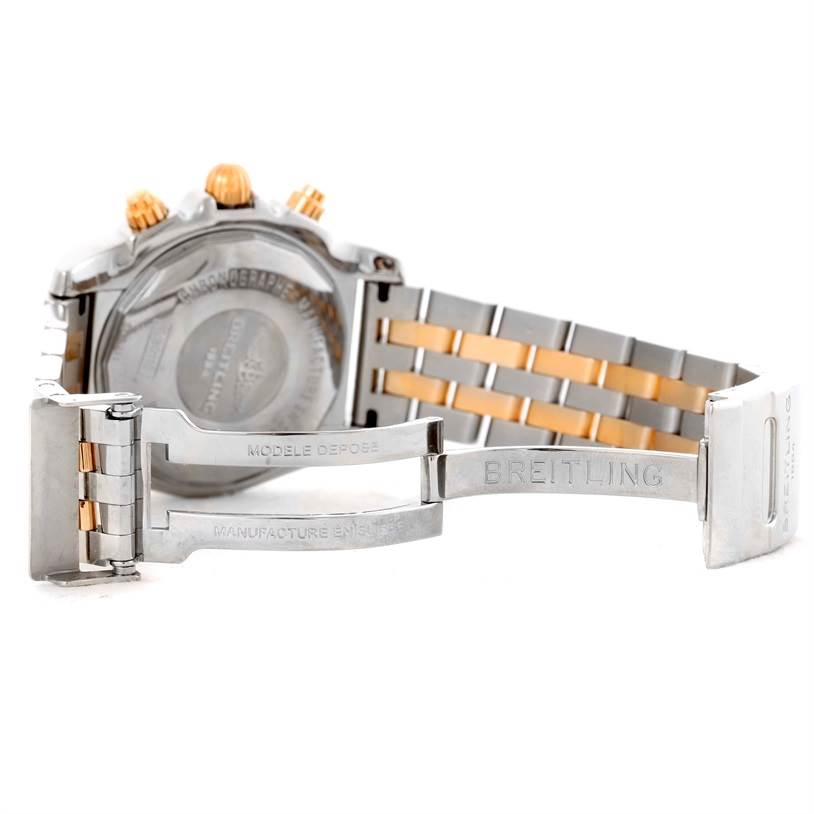 The image shows the back casing and open clasp of the Breitling Chronomat CB0110 Men's Steel and Gold (two tone) Black Dial CB0110 Men's Steel and Gold (two tone) Black Dial watch, highlighting its bracelet and deployment buckle.