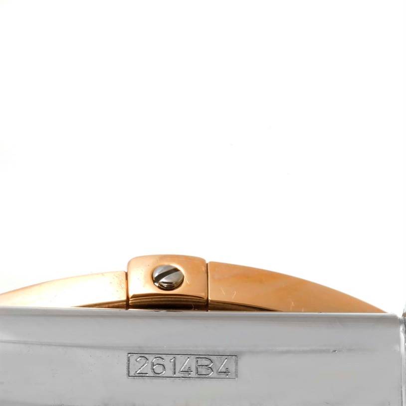 This image shows the clasp of a Breitling Chronomat CB0110 Men's Steel and Gold (two tone) Black Dial CB0110 Men's Steel and Gold (two tone) Black Dial watch, with part of the bracelet and a serial number visible.