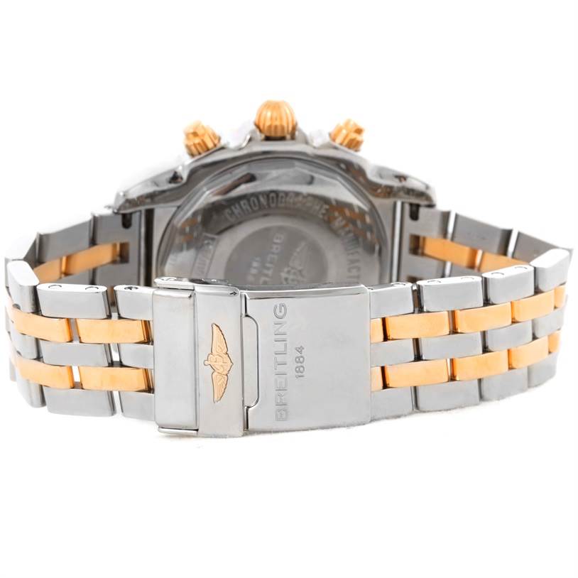 The image shows the back of a Breitling Chronomat CB0110 Men's Steel and Gold (two tone) Black Dial CB0110 Men's Steel and Gold (two tone) Black Dial watch, highlighting the bracelet and clasp with branding.