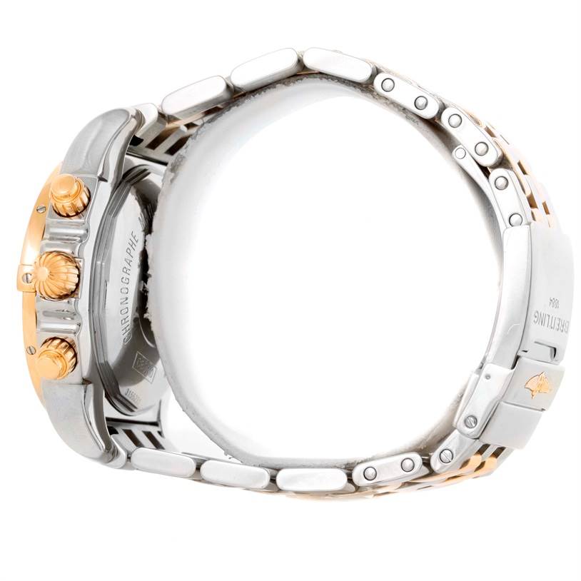 The image shows a side view of the Breitling Chronomat CB0110 Men's Steel and Gold (two tone) Black Dial CB0110 Men's Steel and Gold (two tone) Black Dial watch, highlighting the bracelet, pushers, and crown.