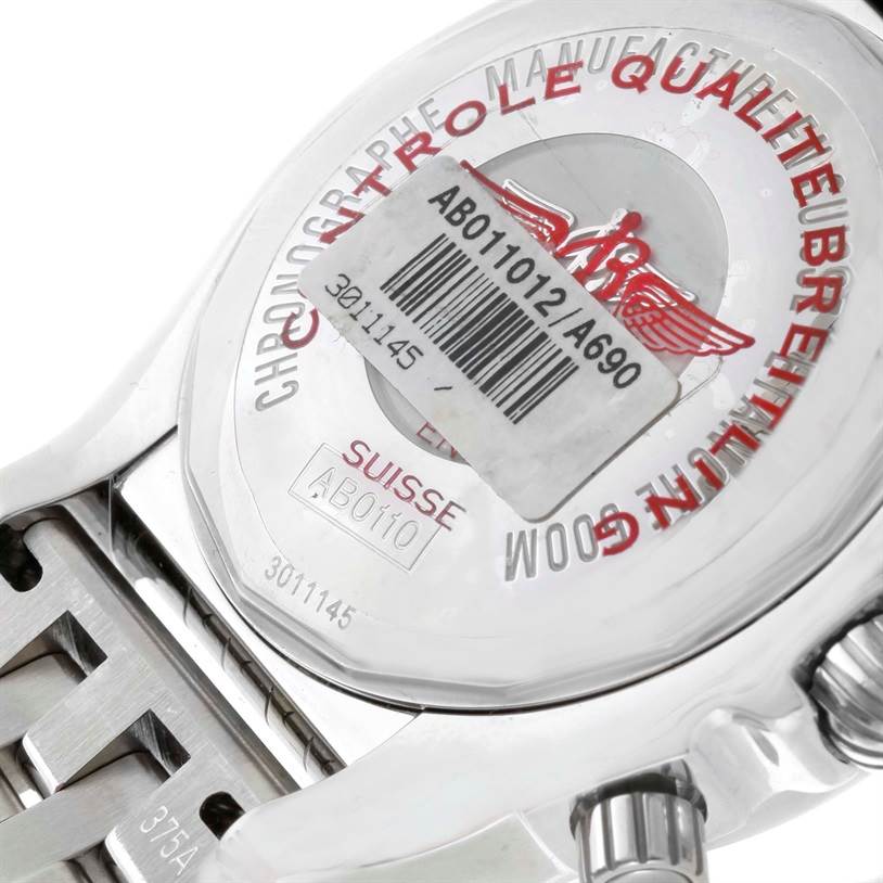 The image shows the back case and part of the bracelet of a Breitling Chronomat AB0110 Men
s Stainless Steel White Dial AB0110 Men
s Stainless Steel White Dial watch at a close-up angle.