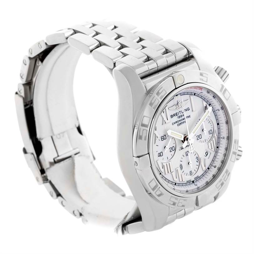 The image shows a Breitling Chronomat AB0110 Men
s Stainless Steel White Dial AB0110 Men
s Stainless Steel White Dial watch from a side angle, highlighting the dial, bezel, and metal bracelet.