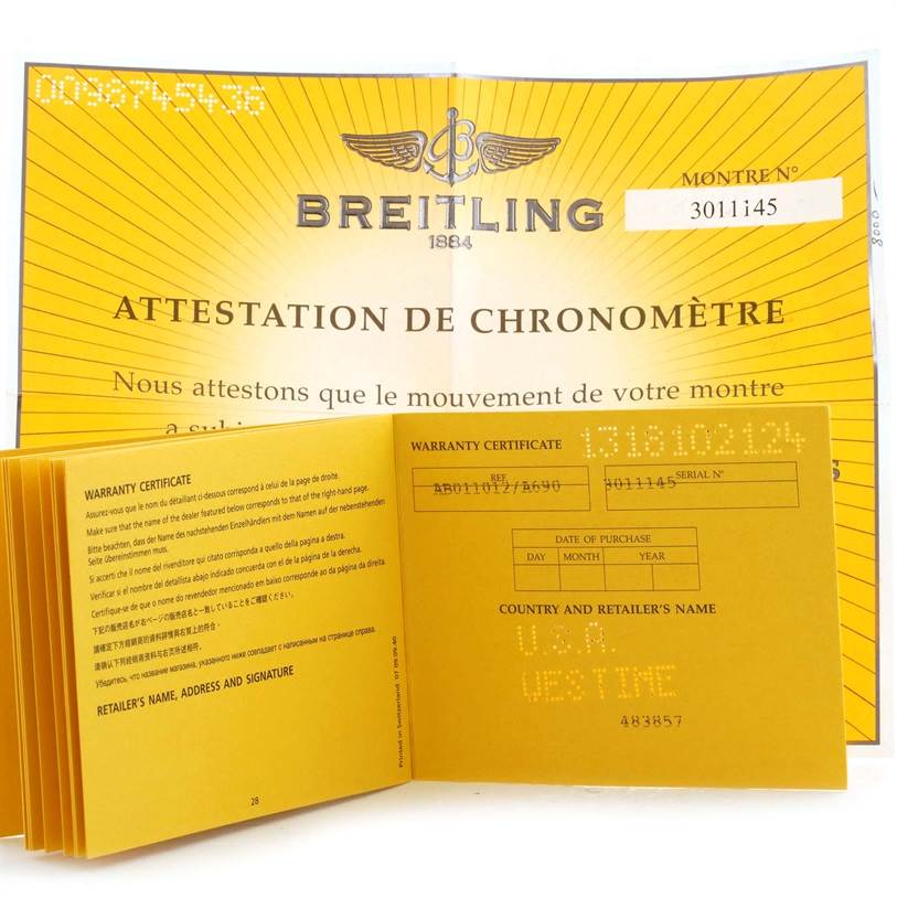 The image shows a Breitling Chronomat AB0110 Men
s Stainless Steel White Dial AB0110 Men
s Stainless Steel White Dial watch
s warranty certificate and chronometer certification document, viewed from the front.