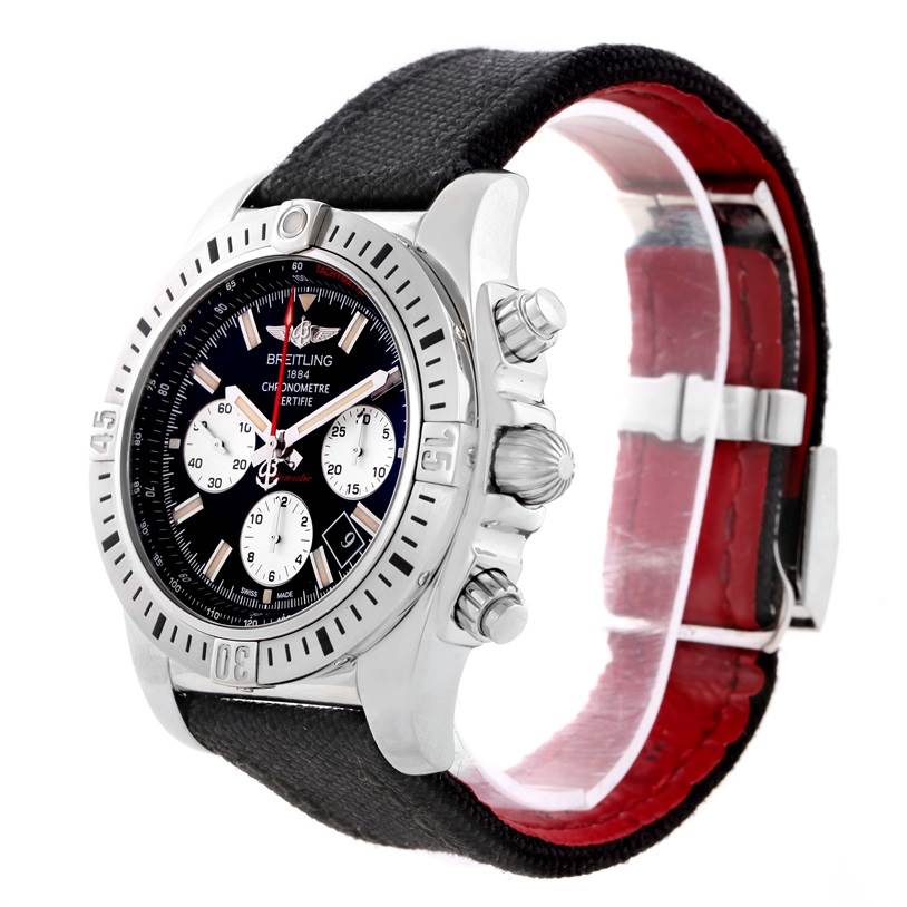 The Chronomat model by Breitling is shown from a side angle, displaying the bezel, dial, pushers, and partially the black and red strap.