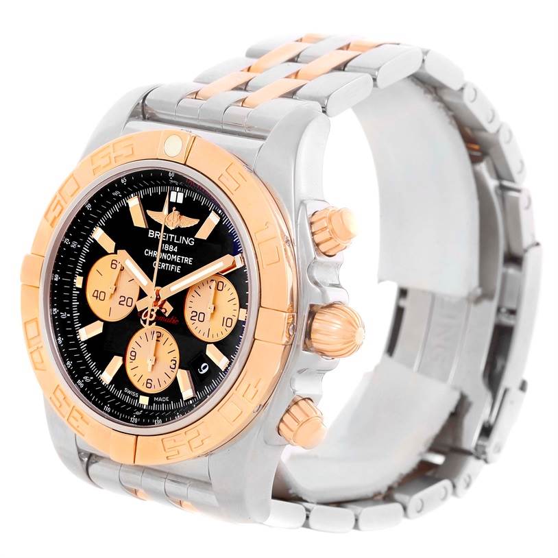 The image shows a Breitling Chronomat CB0110 Men's Steel and Gold (two tone) Black Dial CB0110 Men's Steel and Gold (two tone) Black Dial watch at a slight side angle, highlighting the face, bezel, crown, pushers, and bracelet.
