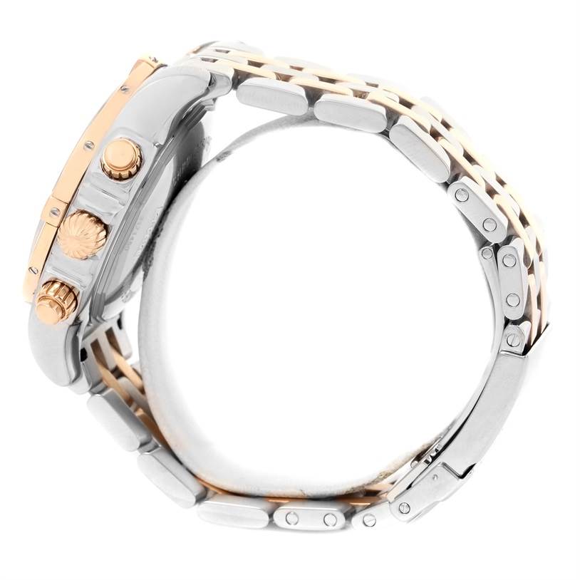 The image shows the side view of a Breitling Chronomat CB0110 Men's Steel and Gold (two tone) Black Dial CB0110 Men's Steel and Gold (two tone) Black Dial watch, highlighting the crown, pushers, and metal bracelet.