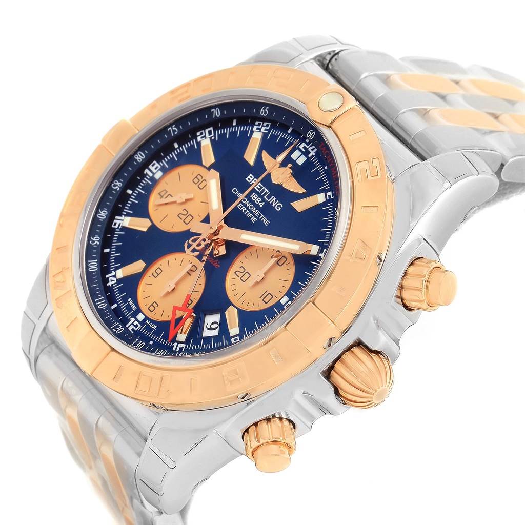The Breitling Chronomat CB042012/C858 Men's Steel and Gold (two tone) Blue Dial CB042012/C858 Men's Steel and Gold (two tone) Blue Dial watch is shown at an angled view, highlighting its face, bezel, crown, and pushers.
