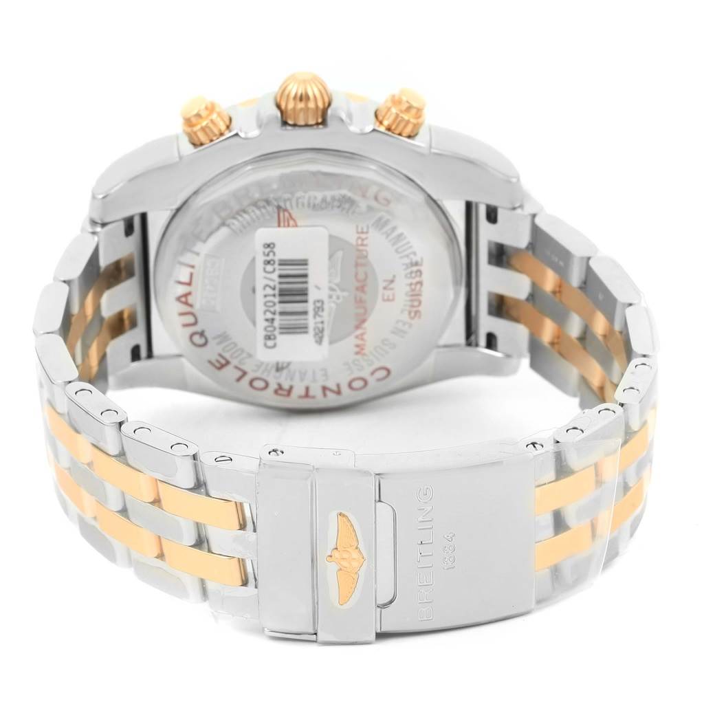 This image shows the back case, crown, and bracelet of a Breitling Chronomat CB042012/C858 Men's Steel and Gold (two tone) Blue Dial CB042012/C858 Men's Steel and Gold (two tone) Blue Dial watch at a rear angle.