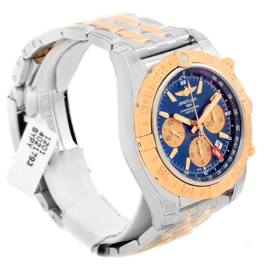 The Breitling Chronomat CB042012/C858 Men's Steel and Gold (two tone) Blue Dial CB042012/C858 Men's Steel and Gold (two tone) Blue Dial watch is shown at an angled side view, displaying the dial, bezel, and part of the bracelet.