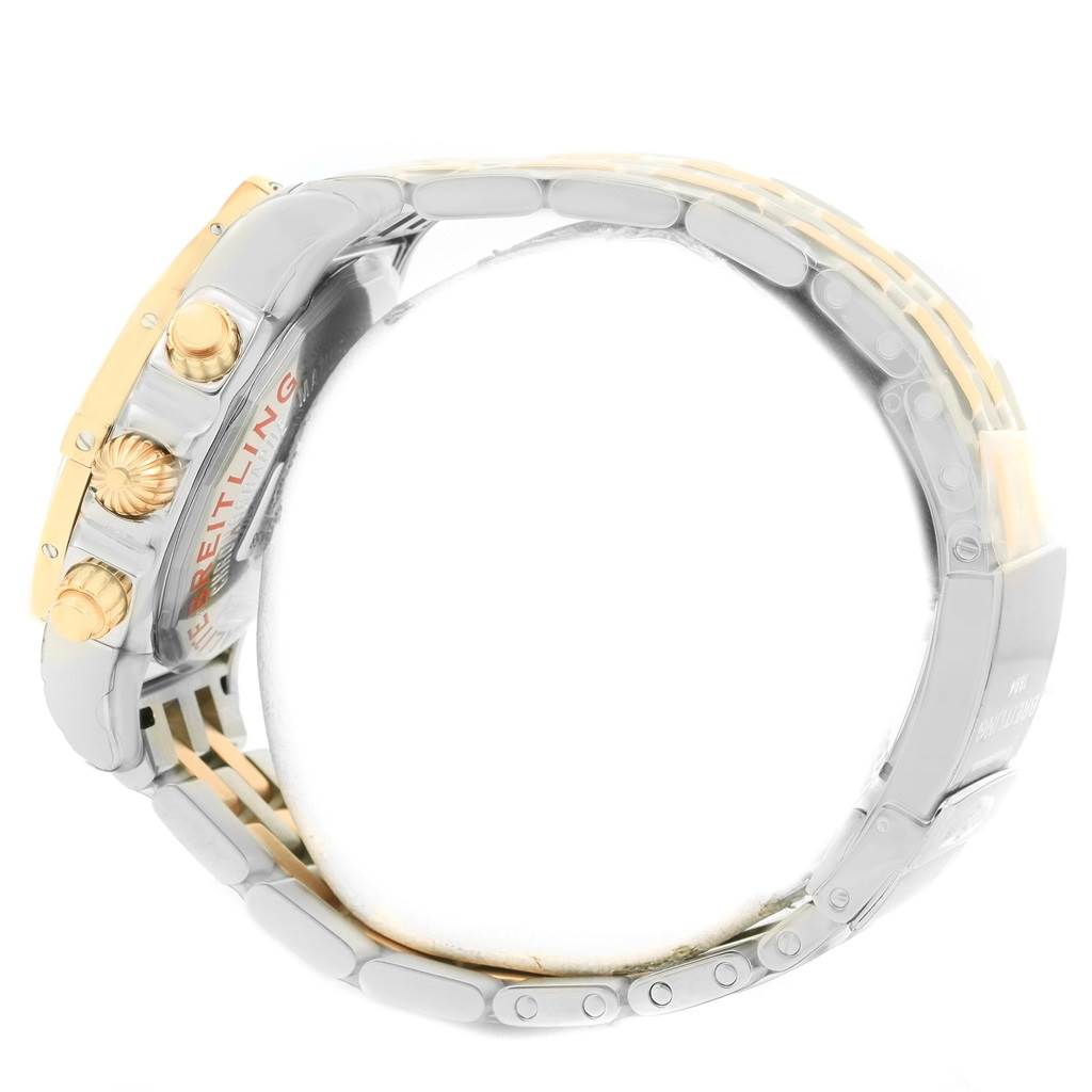 This image shows the side profile of a Breitling Chronomat CB042012/C858 Men's Steel and Gold (two tone) Blue Dial CB042012/C858 Men's Steel and Gold (two tone) Blue Dial watch, highlighting the crown, pushers, and part of the bracelet.