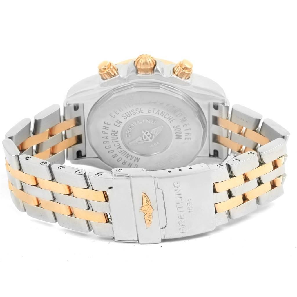 The image shows the back and clasp of the Breitling Chronomat C13356 Men's Steel and Gold (two tone) White Dial C13356 Men's Steel and Gold (two tone) White Dial watch, highlighting the case back and the two-toned metal bracelet.