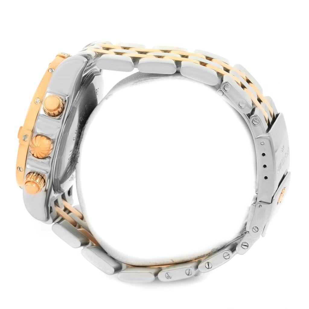 The image shows a side view of a Breitling Chronomat C13356 Men's Steel and Gold (two tone) White Dial C13356 Men's Steel and Gold (two tone) White Dial watch, highlighting its case, crown, push buttons, and bracelet.