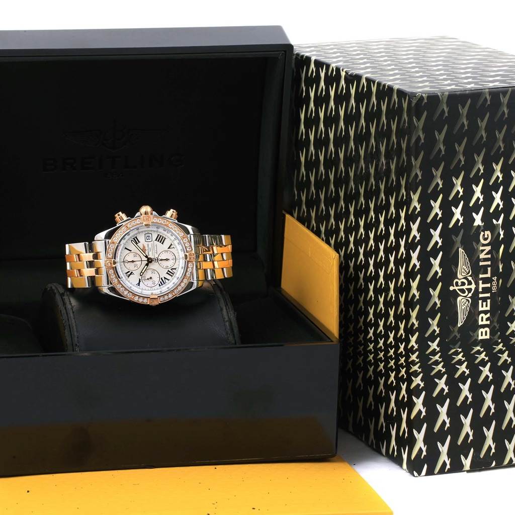 The Breitling Chronomat C13356 Men's Steel and Gold (two tone) White Dial C13356 Men's Steel and Gold (two tone) White Dial watch is shown from a frontal angle, nestled in its presentation box, with the bracelet visible.