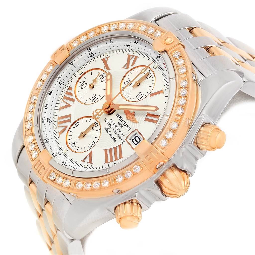 The Breitling Chronomat C13356 Men's Steel and Gold (two tone) White Dial C13356 Men's Steel and Gold (two tone) White Dial watch is shown at an angled view, displaying the face, bezel, crown, and part of the bracelet.