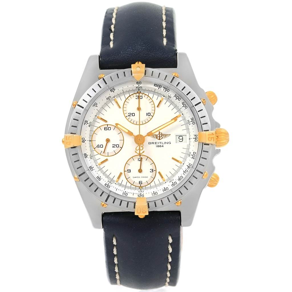 The image shows a front view of the Breitling Chronomat B13047 Men
s Steel and Gold (two tone) White Dial B13047 Men
s Steel and Gold (two tone) White Dial watch displaying its dial, bezel, subdials, and leather strap.