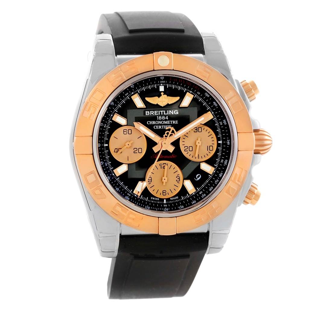 The Breitling Chronomat CB0140 Men's Steel and Gold (two tone) Black Dial CB0140 Men's Steel and Gold (two tone) Black Dial watch is shown from a front angle, highlighting its dial, bezel, and black strap.