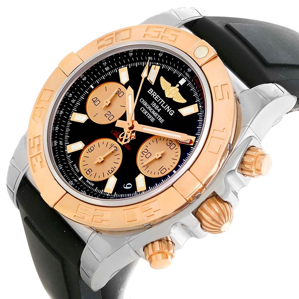 The Breitling Chronomat CB0140 Men's Steel and Gold (two tone) Black Dial CB0140 Men's Steel and Gold (two tone) Black Dial watch is shown at a slight angle, displaying the dial, bezel, crown, chronograph pushers, and part of the strap.