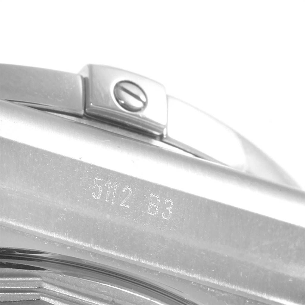 The image shows a close-up of a part of the Breitling Chronomat AB041210/BB48 - 384A Men's Stainless Steel Black Dial AB041210/BB48 - 384A Men's Stainless Steel Black Dial watch, focusing on the clasp and a portion of the bracelet.