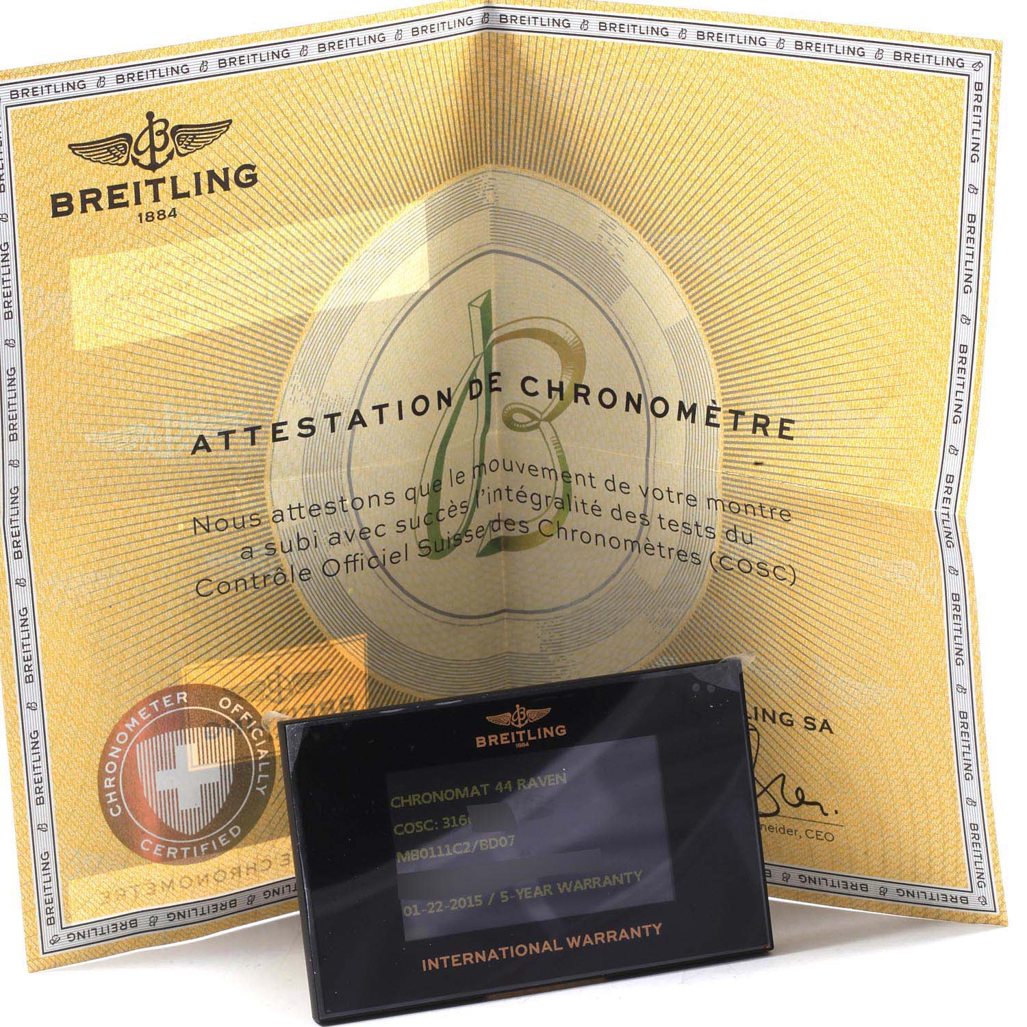 The image shows an official Breitling Chronomat MB0111C2/BD07/153S Men's Stainless Steel Black Dial MB0111C2/BD07/153S Men's Stainless Steel Black Dial 44 Raven chronometer certificate and an international warranty card.
