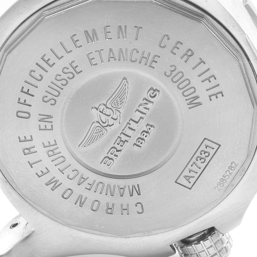 This image shows the back case of a Breitling Chronomat A17331 Men's Stainless Steel Yellow Dial A17331 Men's Stainless Steel Yellow Dial watch, highlighting its engravings and certification details.