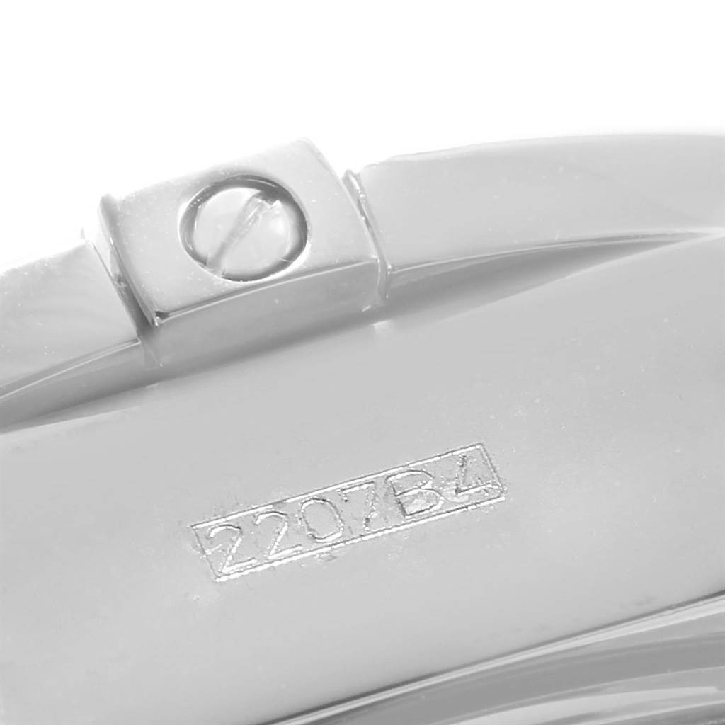 This image shows a close-up of a screw and engraved marking on the strap clasp of a Breitling Chronomat A13356 Men's Stainless Steel Mother of Pearl Dial A13356 Men's Stainless Steel Mother of Pearl Dial watch.