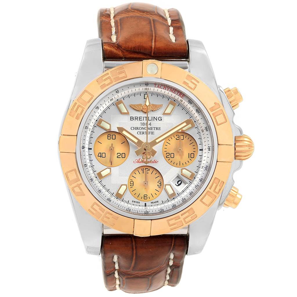 The Breitling Chronomat CB014012 Men
s Steel and Gold (two tone) Silver Dial CB014012 Men
s Steel and Gold (two tone) Silver Dial watch is shown from a front angle, highlighting its face, bezel, crown, pushers, and leather strap.