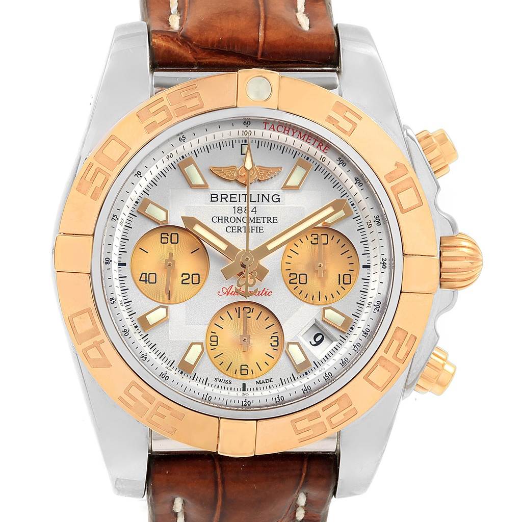 The image shows a front view of the Breitling Chronomat CB014012 Men
s Steel and Gold (two tone) Silver Dial CB014012 Men
s Steel and Gold (two tone) Silver Dial watch displaying the face, bezel, and leather strap.