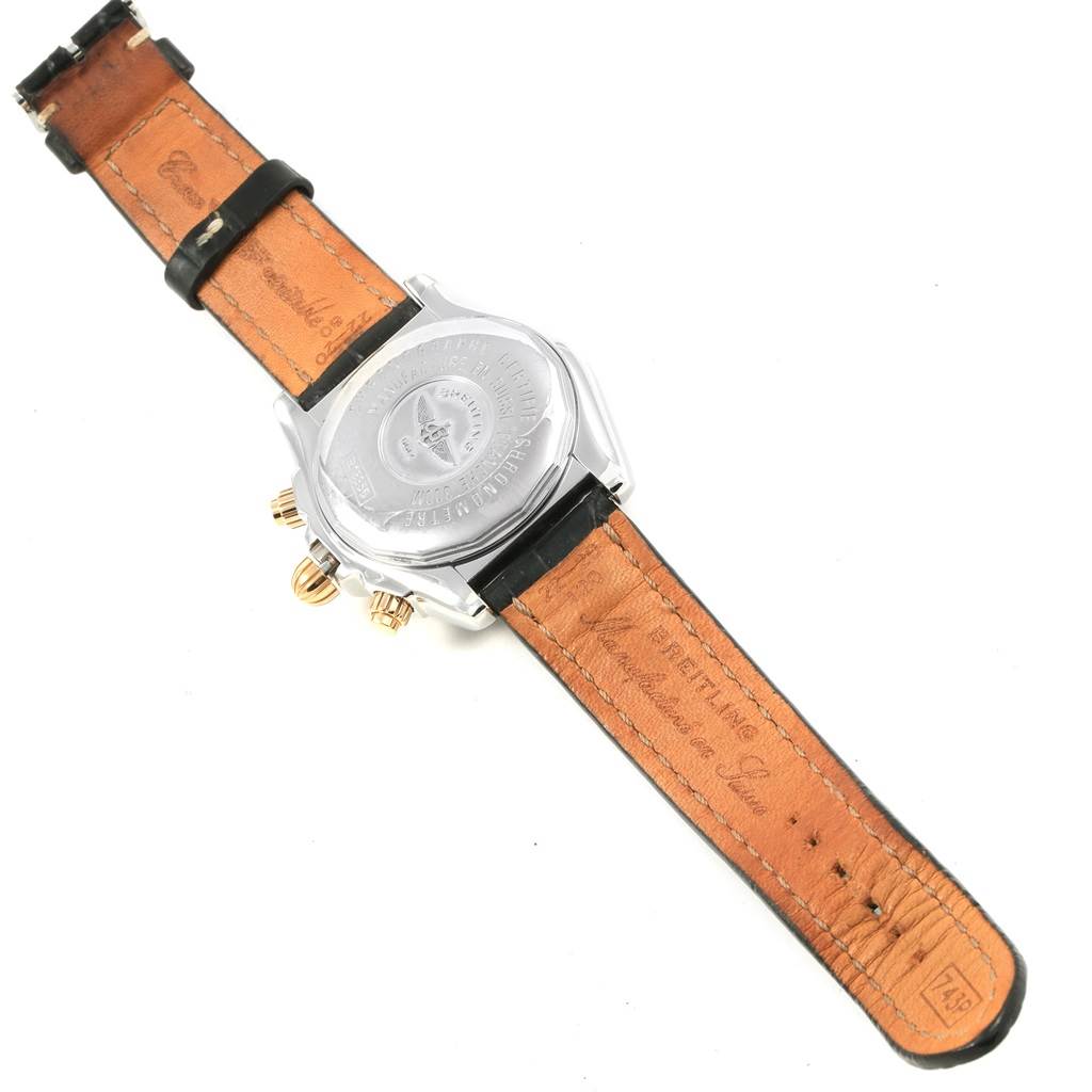 This image shows the back view and leather straps of a Breitling Chronomat B13356 Men's Steel and Gold (two tone) Black Dial B13356 Men's Steel and Gold (two tone) Black Dial watch.