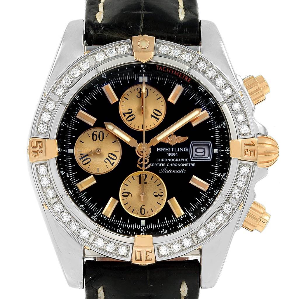 The Breitling Chronomat B13356 Men's Steel and Gold (two tone) Black Dial B13356 Men's Steel and Gold (two tone) Black Dial watch is shown from a front angle, displaying its face, bezel, crown, and pushers.