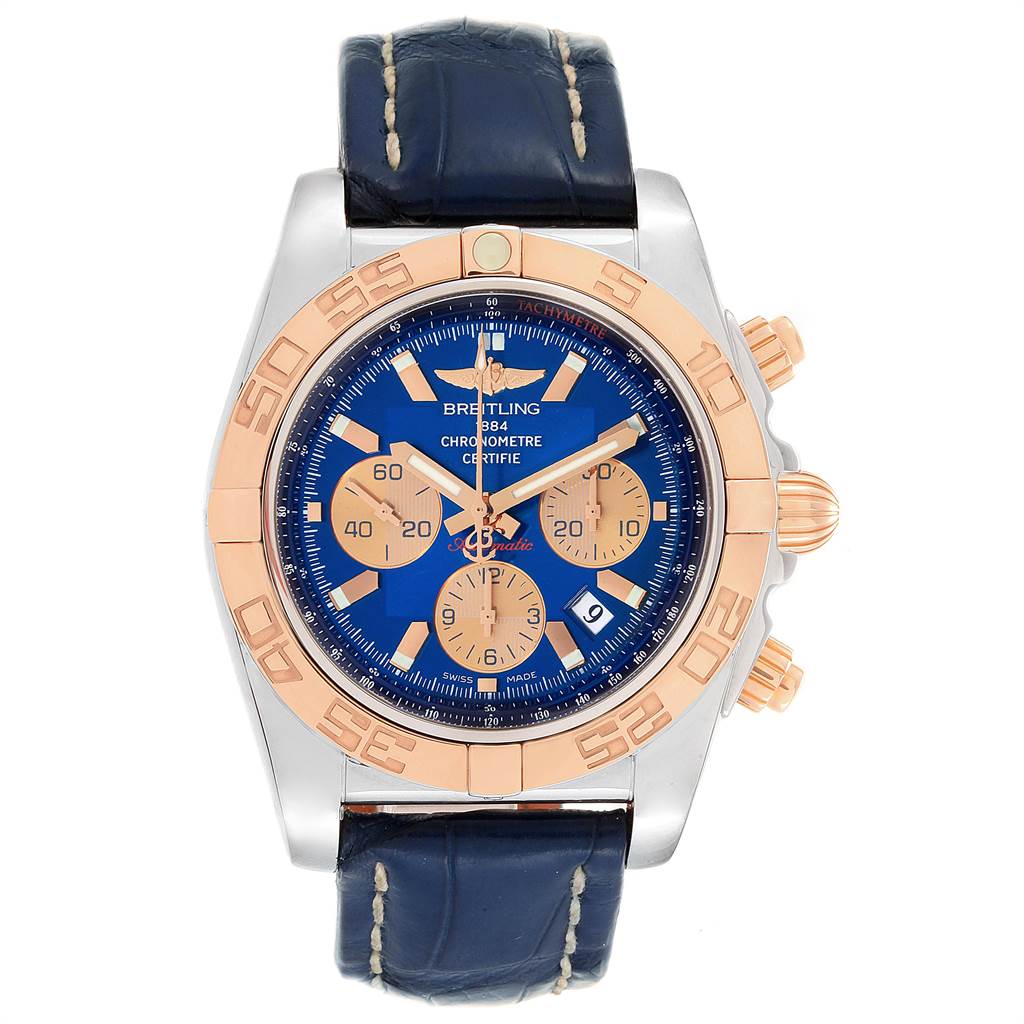 The image shows a front view of a Breitling Chronomat CB0110 Men
s Steel and Gold (two tone) Blue Dial CB0110 Men
s Steel and Gold (two tone) Blue Dial watch, highlighting its blue dial, gold subdials, and dark leather strap.