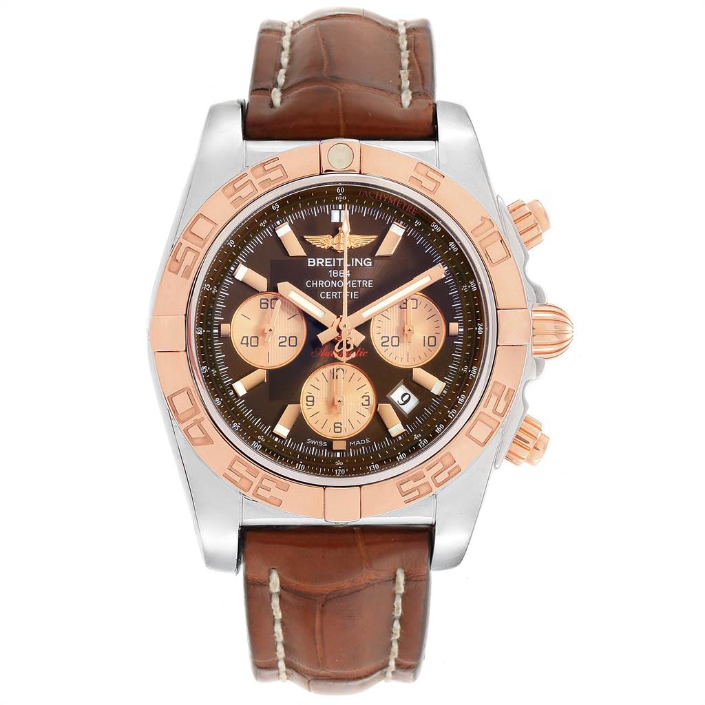 The Breitling Chronomat CB0110 Men
s Steel and Gold (two tone) Brown Dial CB0110 Men
s Steel and Gold (two tone) Brown Dial watch is shown from a top-down angle, featuring a brown leather strap, and a stainless steel case with a gold bezel.