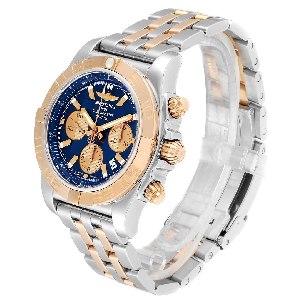 The Breitling Chronomat CB011012/C790 Men's Steel and Gold (two tone) Blue Dial CB011012/C790 Men's Steel and Gold (two tone) Blue Dial watch is shown at an oblique angle, highlighting the face, bezel, buttons, and two-tone bracelet.