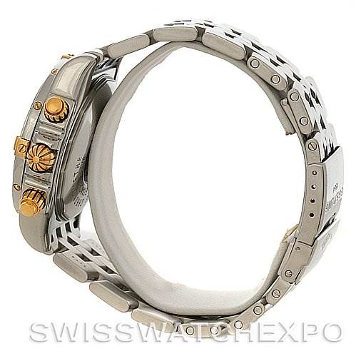 The image shows a side view of the Breitling Chronomat B1335611 Men's Steel and Gold (two tone) Blue Dial B1335611 Men's Steel and Gold (two tone) Blue Dial watch, highlighting its metal bracelet and gold-accented crown and pushers.