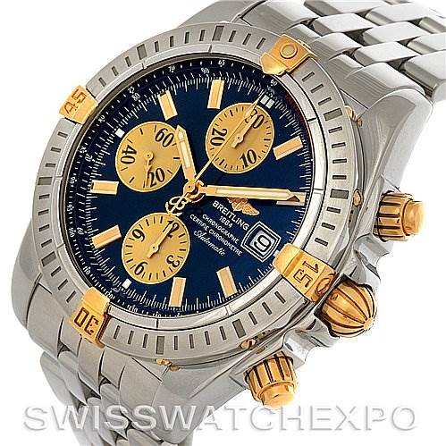The image shows a Breitling Chronomat B1335611 Men's Steel and Gold (two tone) Blue Dial B1335611 Men's Steel and Gold (two tone) Blue Dial watch at a three-quarter angle, highlighting the bezel, dial, subdials, and crown.