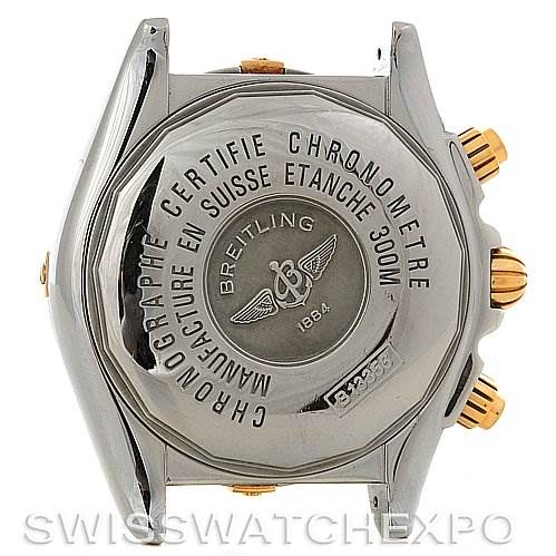 The image shows the back case and side pushers of a Breitling Chronomat B1335611 Men's Steel and Gold (two tone) Blue Dial B1335611 Men's Steel and Gold (two tone) Blue Dial watch, highlighting its certifications and branding.