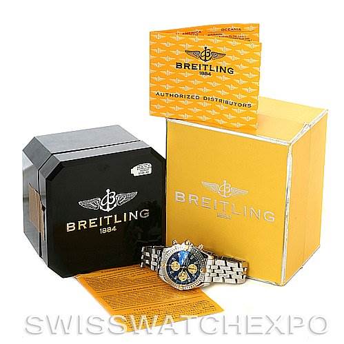 The image shows a Breitling Chronomat B1335611 Men's Steel and Gold (two tone) Blue Dial B1335611 Men's Steel and Gold (two tone) Blue Dial watch, its yellow and black boxes, and accompanying documentation at a slight angle.