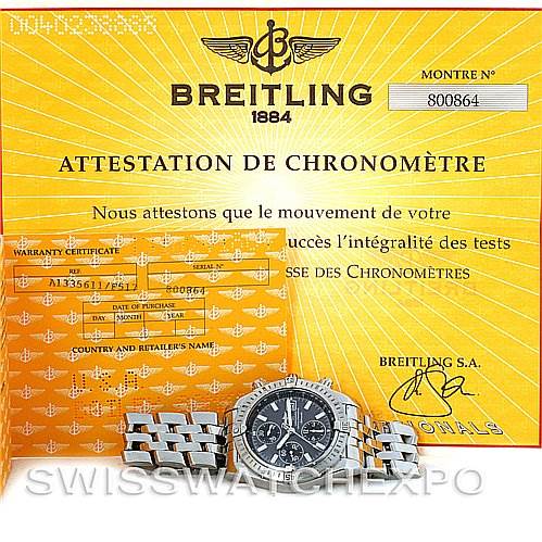 The image shows a Breitling Chronomat A1335611/F517 Men's Stainless Steel Grey Dial A1335611/F517 Men's Stainless Steel Grey Dial watch lying flat, along with its warranty certificate and attestation of chronometer performance.