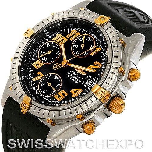This image shows a Breitling Chronomat B13350 Men's Steel and Gold (two tone) Black Dial B13350 Men's Steel and Gold (two tone) Black Dial watch at a tilted angle, highlighting its bezel, chronograph subdials, and pushers.