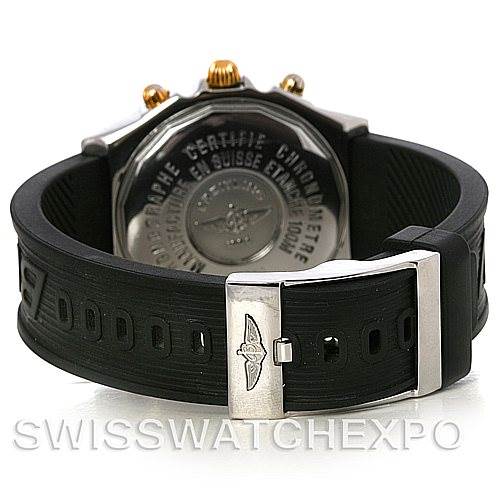 The image shows the back case and rubber strap of a Breitling Chronomat B13350 Men's Steel and Gold (two tone) Black Dial B13350 Men's Steel and Gold (two tone) Black Dial watch, highlighting the clasp and case back engravings.