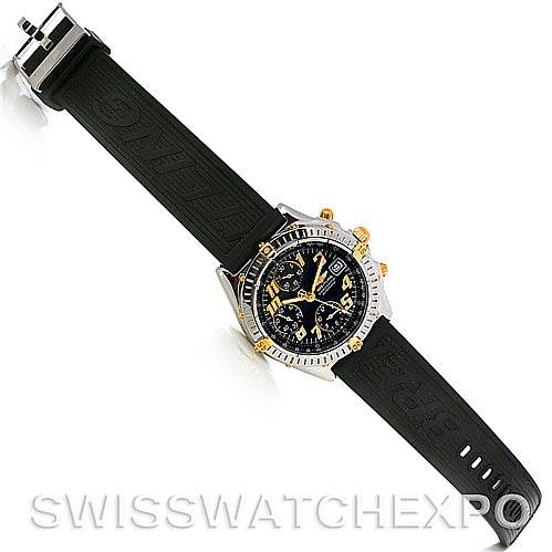 This image shows a top view of the Breitling Chronomat B13350 Men's Steel and Gold (two tone) Black Dial B13350 Men's Steel and Gold (two tone) Black Dial watch, highlighting its face, bezel, crown, pushers, and black rubber strap.
