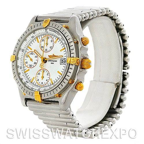 This image shows a side angle view of a Breitling Chronomat B13050 Men's Steel and Gold (two tone) White Dial B13050 Men's Steel and Gold (two tone) White Dial watch, highlighting the bezel, dial, and stainless-steel bracelet.