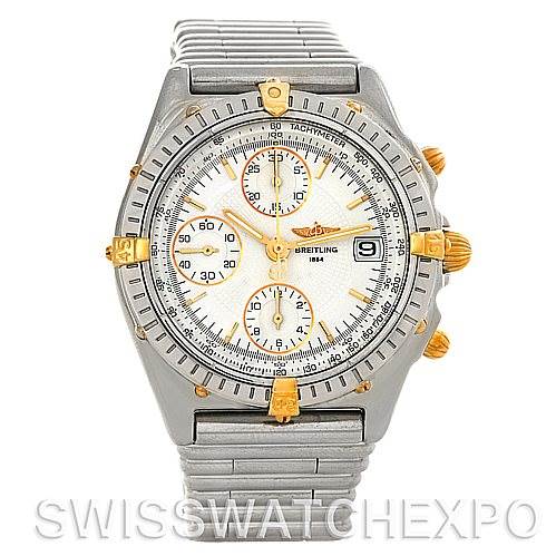 The image shows a front view of the Breitling Chronomat B13050 Men's Steel and Gold (two tone) White Dial B13050 Men's Steel and Gold (two tone) White Dial watch, highlighting its bezel, dial, subdials, and integrated metal bracelet.