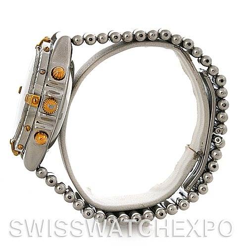 The Breitling Chronomat B13050 Men's Steel and Gold (two tone) White Dial B13050 Men's Steel and Gold (two tone) White Dial watch is shown from a side profile, highlighting the case, crown, pushers, and bracelet.