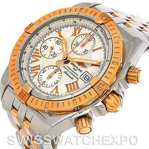The image shows a Breitling Chronomat C13356 Men's Steel and Gold (two tone) White Dial C13356 Men's Steel and Gold (two tone) White Dial watch at an angled view, highlighting its bezel, dial with sub-dials, and crown with pushers.